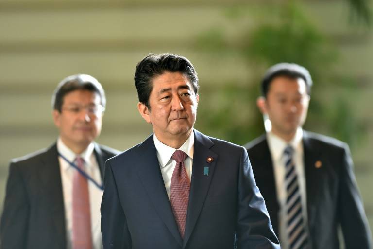 Japan’s prime minister makes cabinet reshuffle as popularity wanes